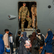In this Aug. 22, 20121, image provided by the U.S. Air Force, service members prepare to board evacuees onto a C-17 Globemaster lll on Sunday, Aug. 22, 2021, at Al Udeid Air Base, Qatar.